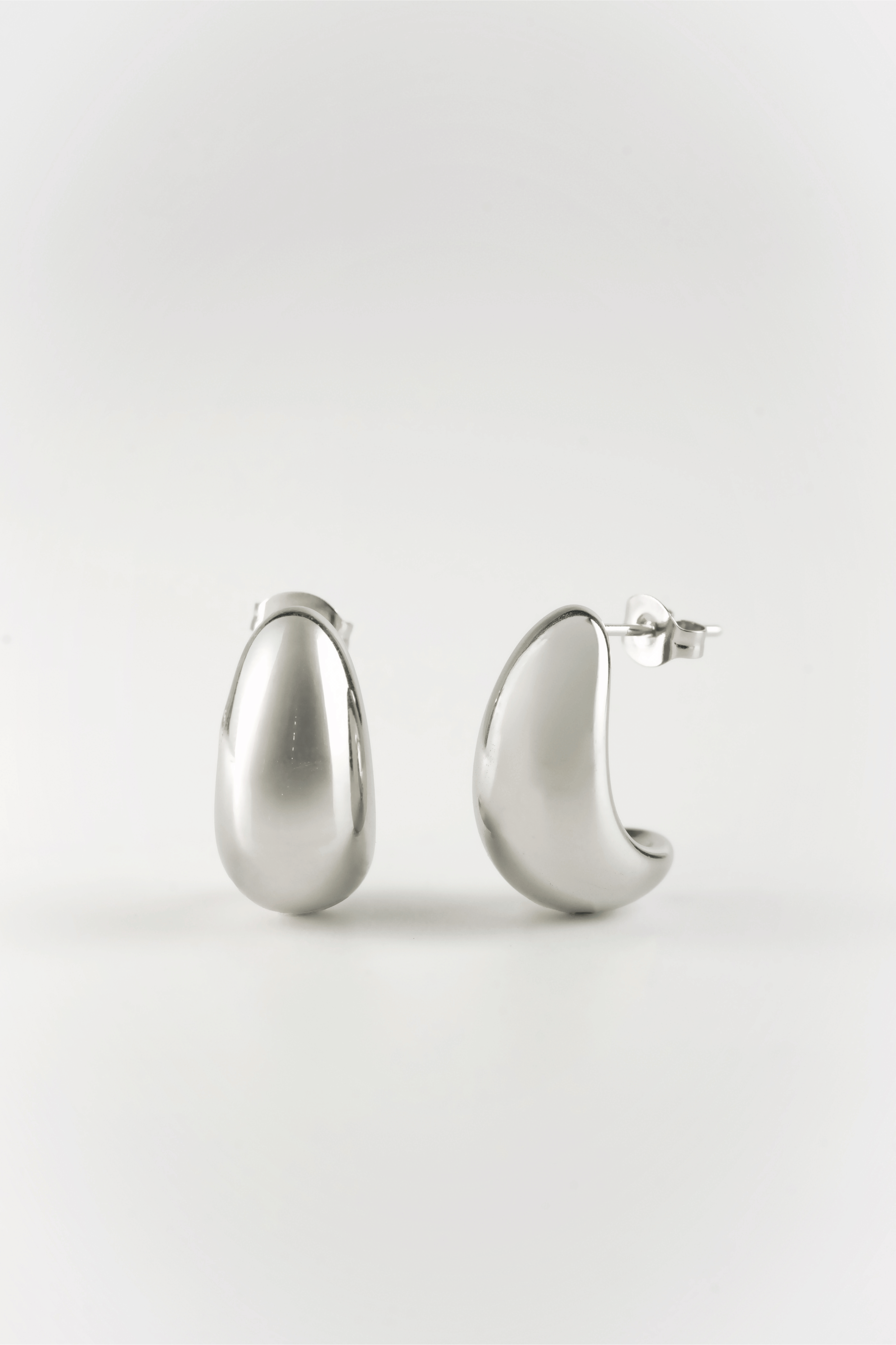 close up sculptural bean earrings high polish finish
