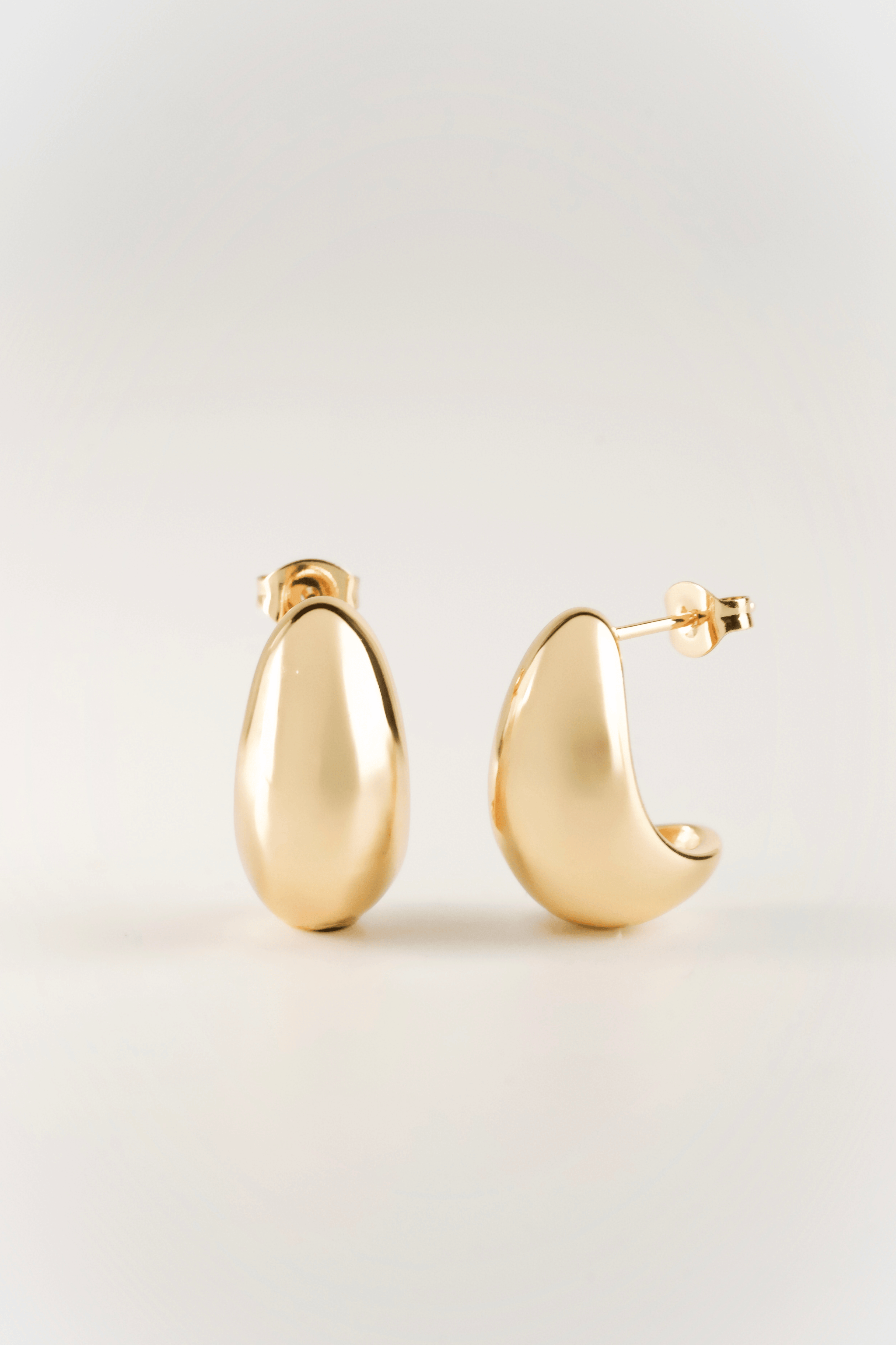 astrid organic sculpt bean earrings front view in gold color