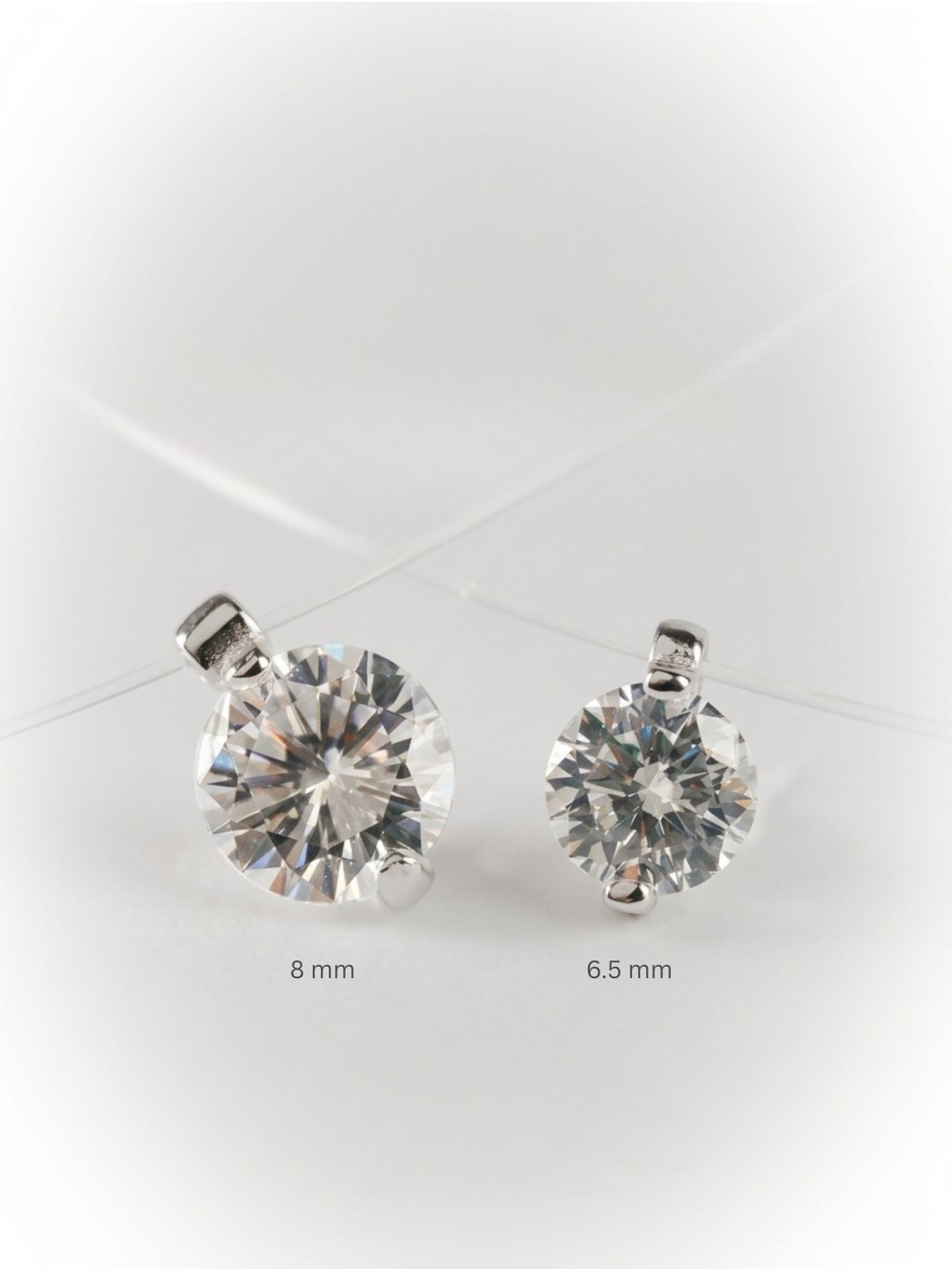 Close-up of floating solitaire cubic zirconia pendant on nylon thread necklace
