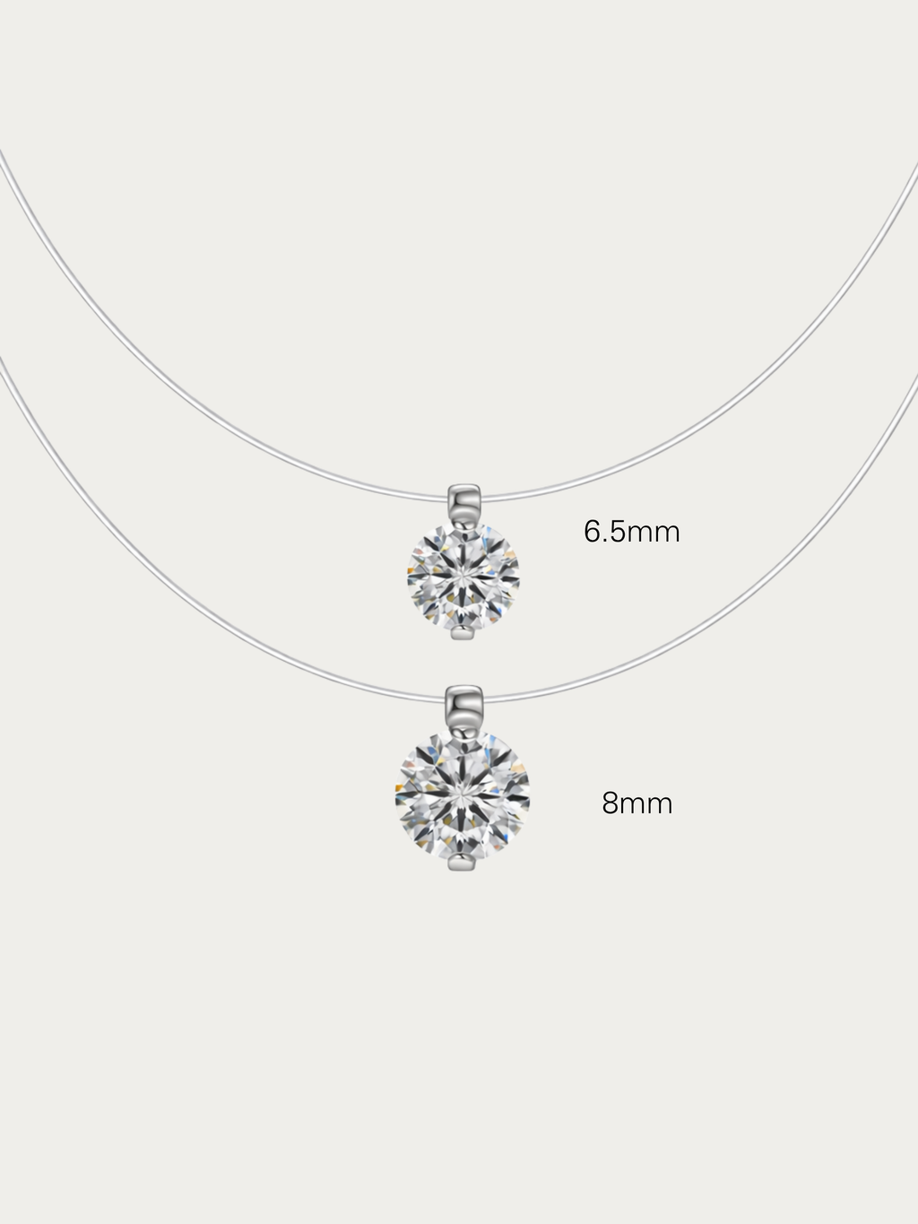 Close-up of floating solitaire cubic zirconia pendant on nylon thread necklace