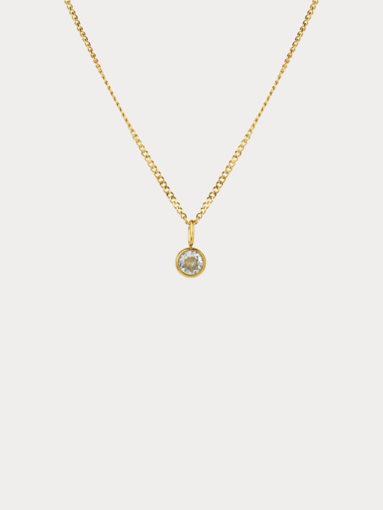 Diamond Curb Chain CZ Pendant Necklace gold tone titanium, round bezel-set CZ on fine curb chain, product flatlay

