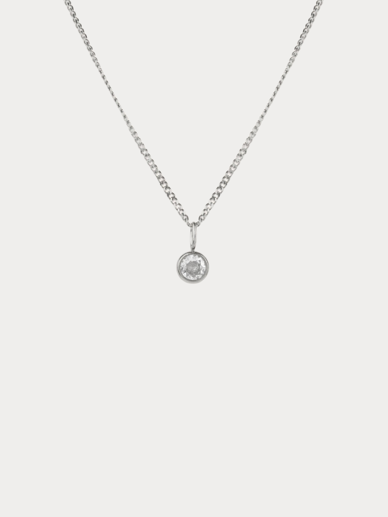 Diamond Curb Chain CZ Pendant Necklace silver tone titanium, round bezel-set CZ on fine curb chain, product flatlay
