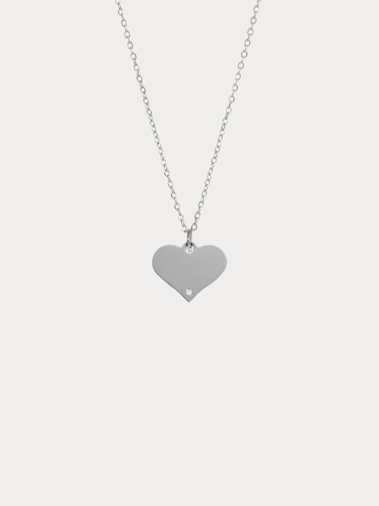 Diamond Heart Engravable Necklace silver tone titanium product flatlay, flat heart pendant on fine cable chain