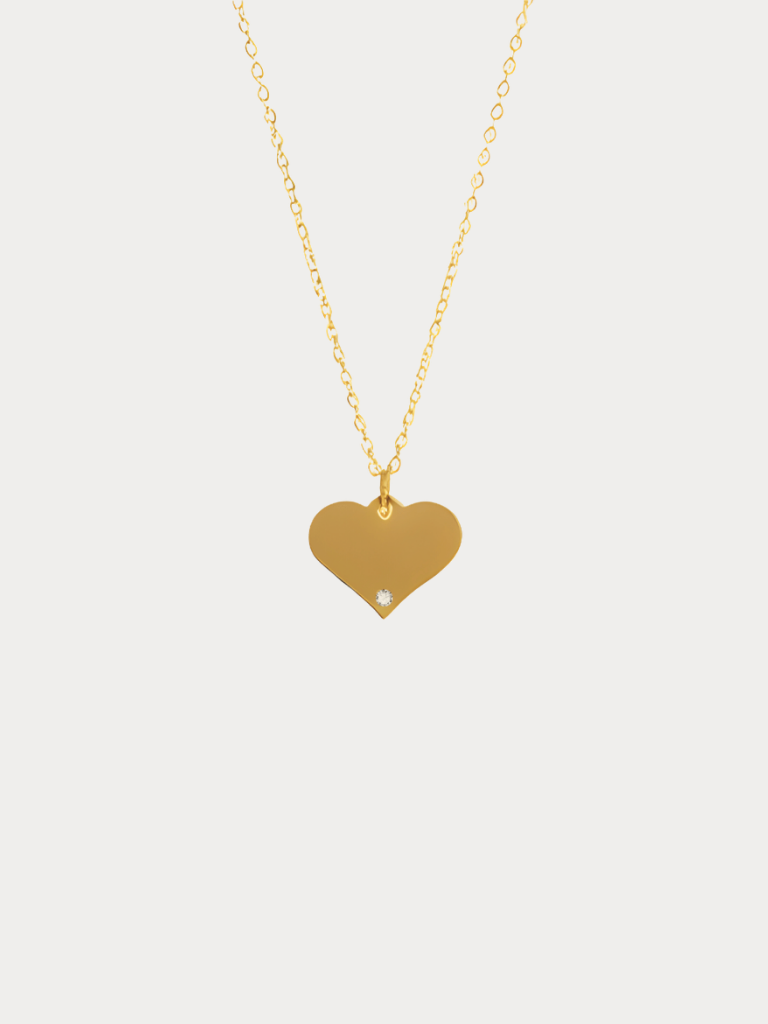 Diamond Heart Engravable Necklace gold tone titanium product flatlay, flat heart pendant on fine cable chain