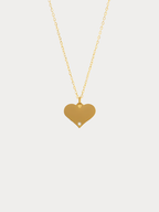 Diamond Heart Engravable Necklace gold tone titanium product flatlay, flat heart pendant on fine cable chain