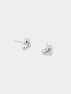 Heart Stud Earrings silver tone stainless steel, puffy 3D heart studs, product flatlay