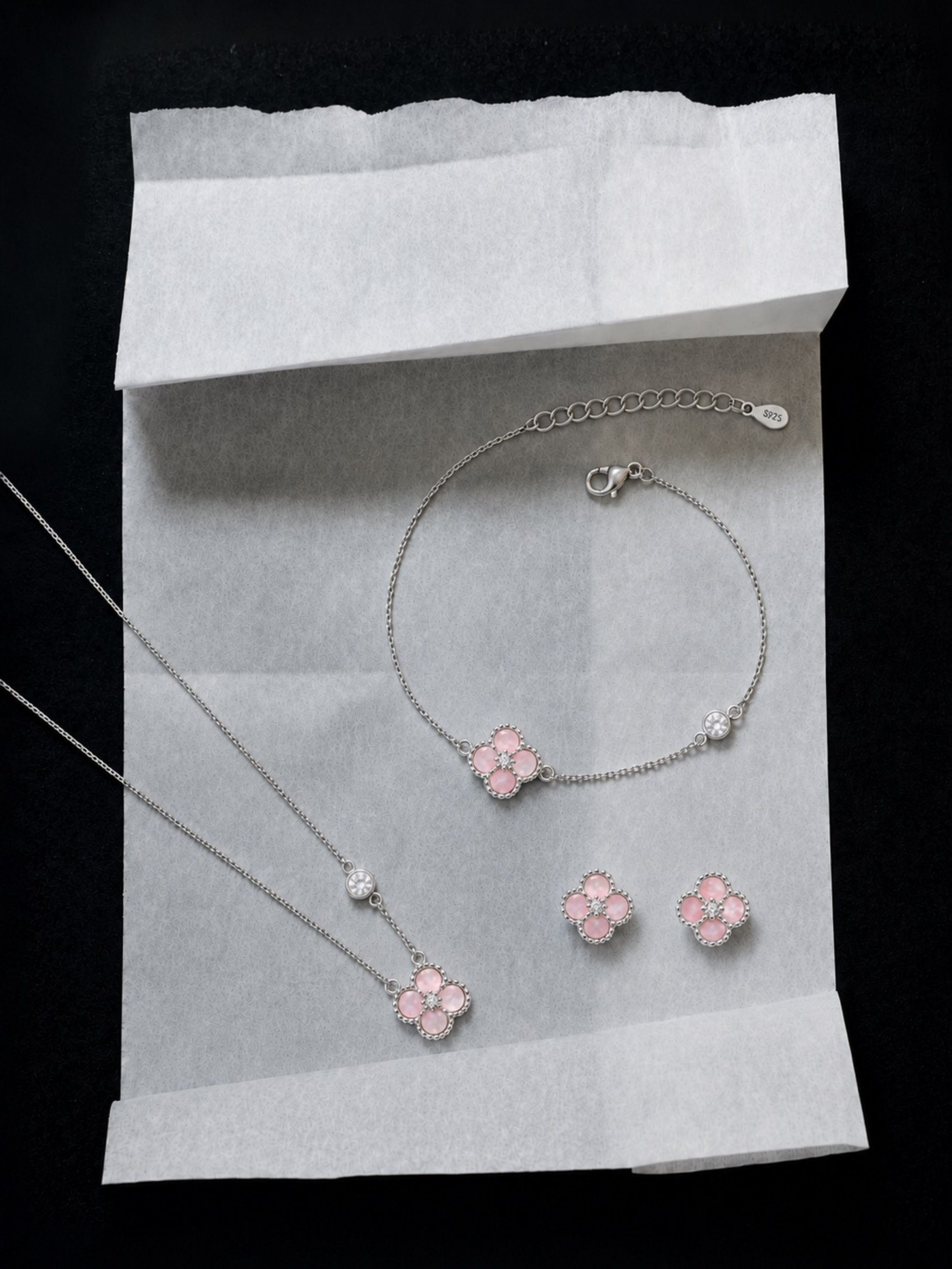 Detail of adjustable extension chain on Jolie bracelet and necklace , ear studs