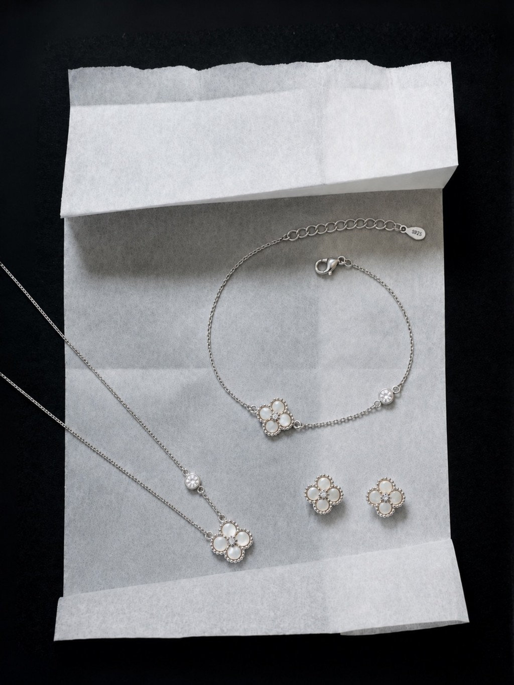 Detail of adjustable extension chain on Jolie bracelet and necklace , ear studs