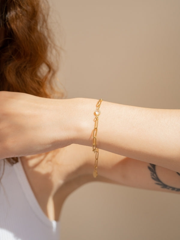 Model's wrist wearing a Lina Crystal Bracelet in gold