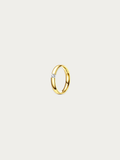 Gold ring with a diamond on a light gray background