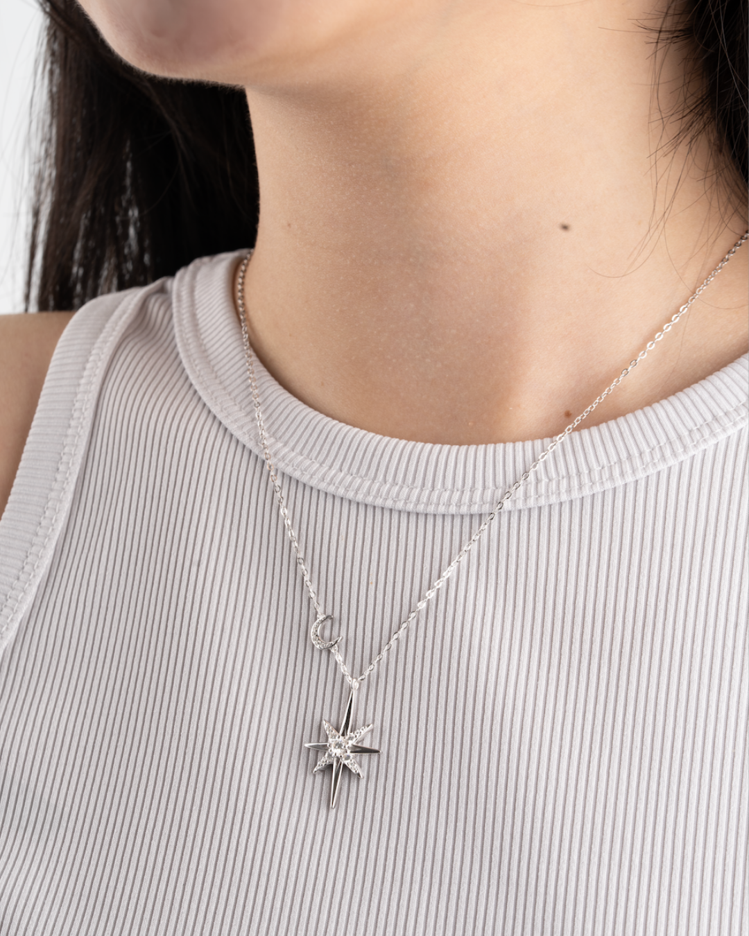 star crescent moissanite necklace on model