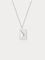 Love Letter Pendant Necklace in silver tone titanium, envelope locket closed front view