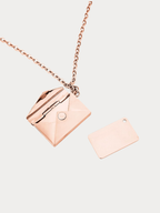 Love Letter Pendant Necklace in rose gold tone titanium, envelope locket open showing inner engraving tag