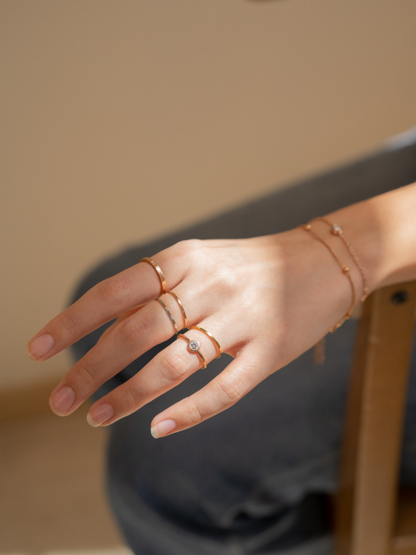 A stack of gold  rings showing the ultra-slim 1.5mm profile.