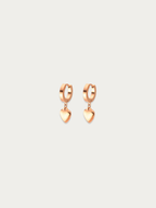 Minimalist heart jewelry in rose gold titanium for sensitive ears.