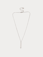 A delicate silver chain necklace with a slim cylindrical pendant, displayed on a light gray background.