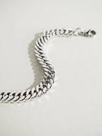 Close-up of interlocking franco chain links on Aegis Curb Chain Bracelet, silver tone stainless steel