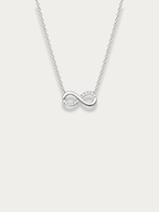Aeterna Infinity CZ Necklace in silver tone, titanium infinity pendant with CZ detailing, front view