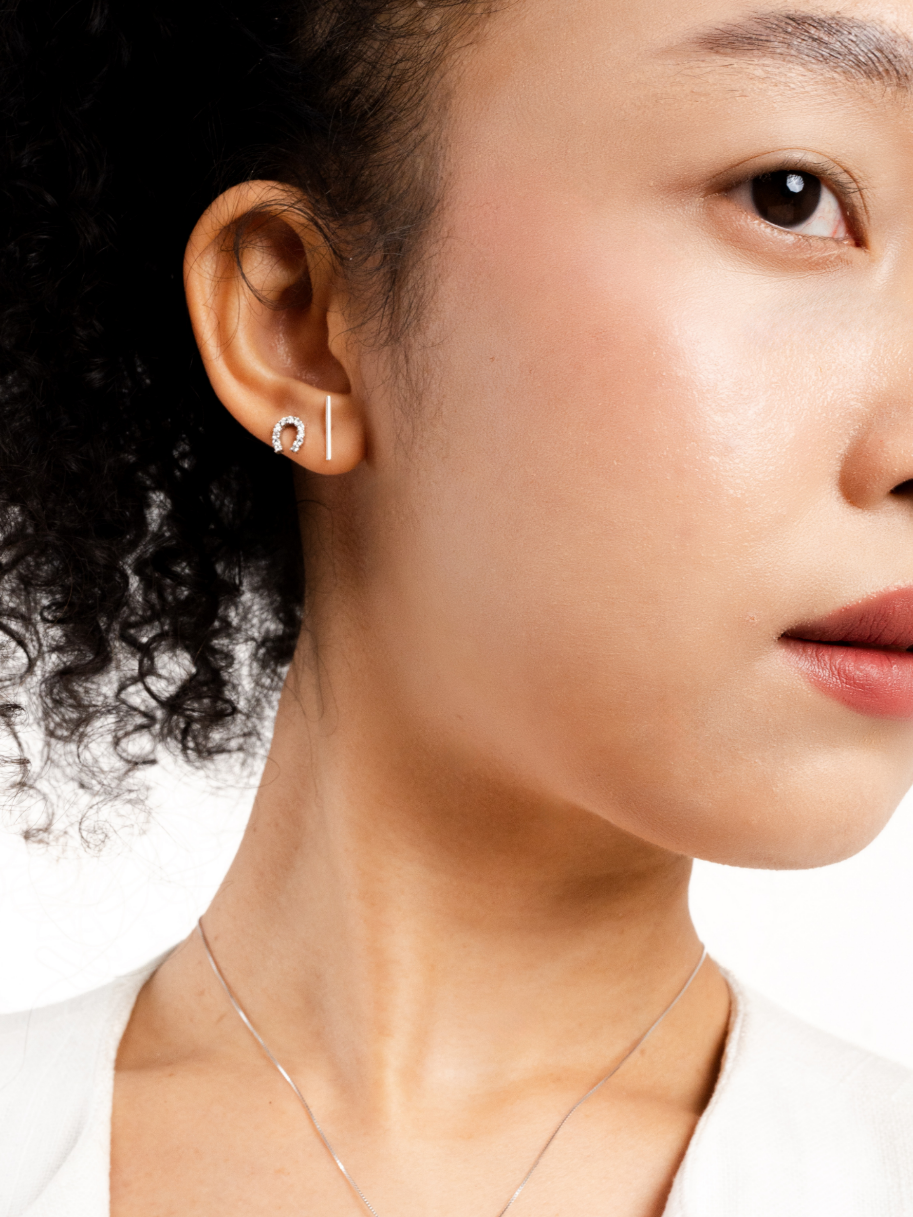 Alaia Minimalist Bar Stud Earrings worn on ear