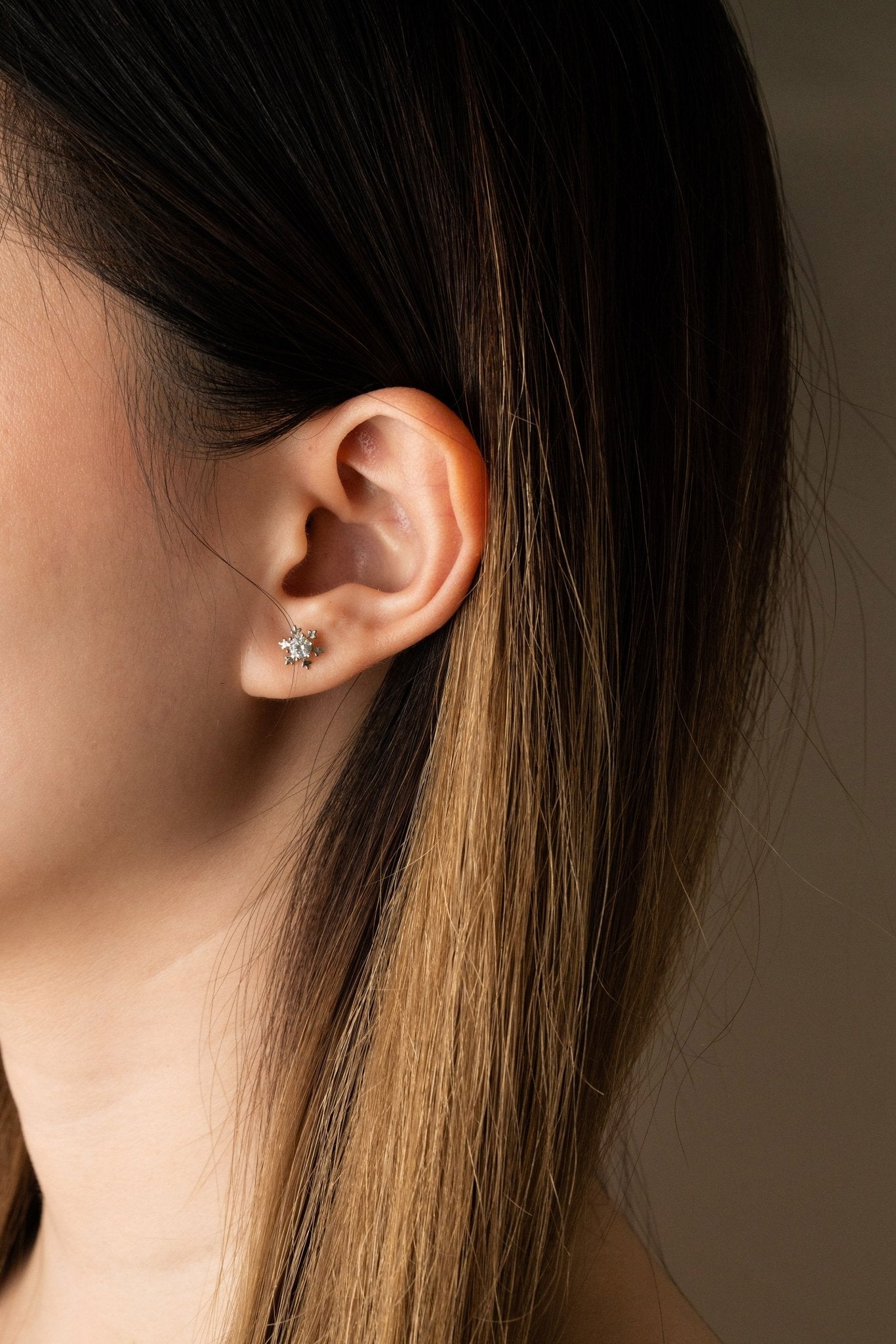 Close-up of single ALASKA Diamond Snowflake stud earring