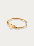 Amour Cable Heart Engravable Bracelet gold tone stainless steel, cable bangle with heart charm, product flatlay