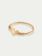 Amour Cable Heart Engravable Bracelet gold tone stainless steel, cable bangle with heart charm, product flatlay