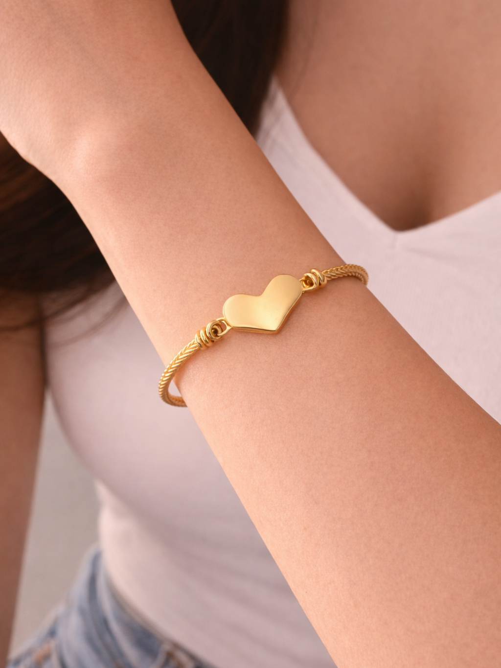 Amour Cable Heart Bracelet gold tone worn on wrist front view, engravable heart charm bangle Malaysia