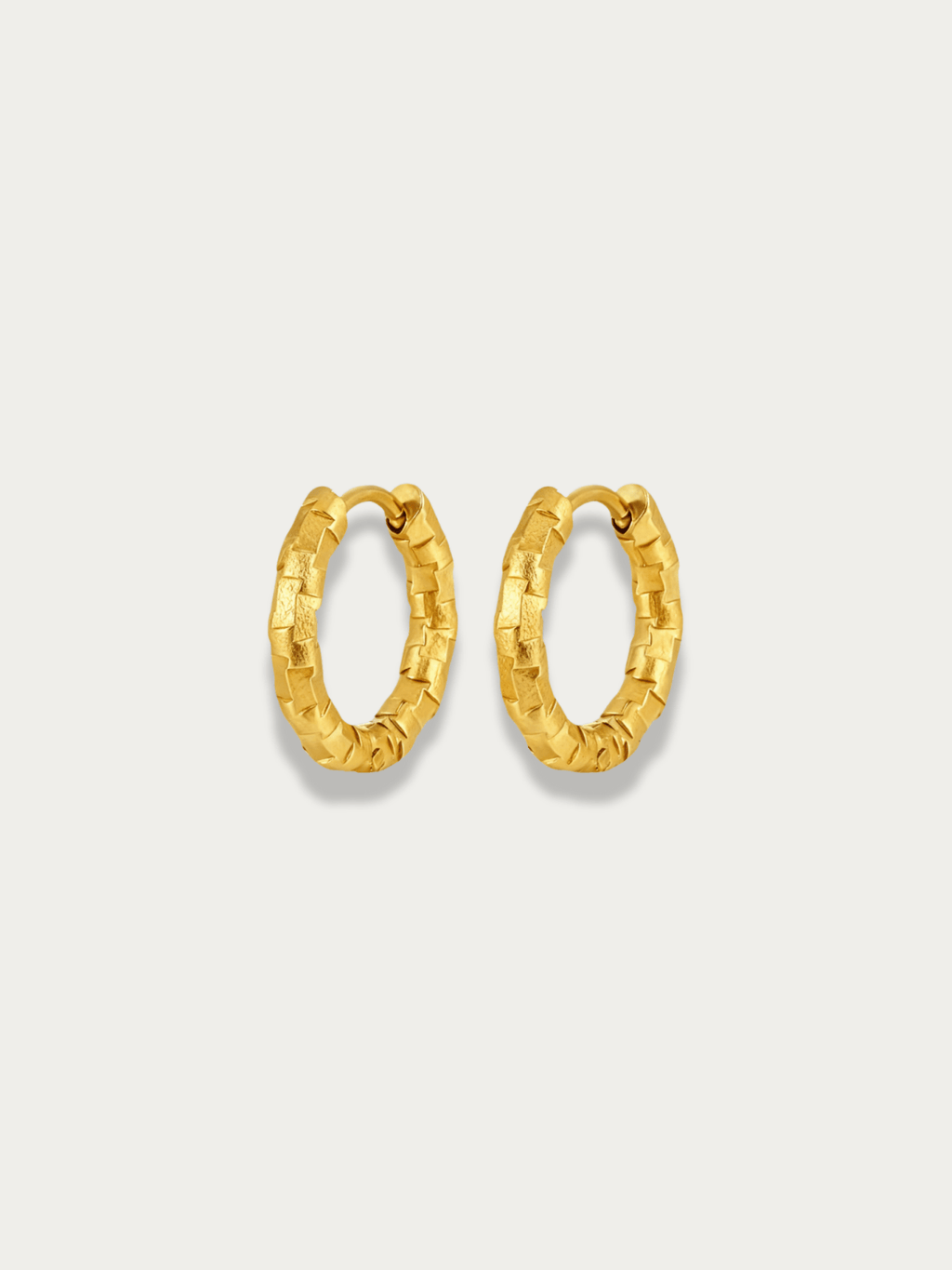 Atlas Textured Hoop Earrings in gold, 15mm size, studio hero shot