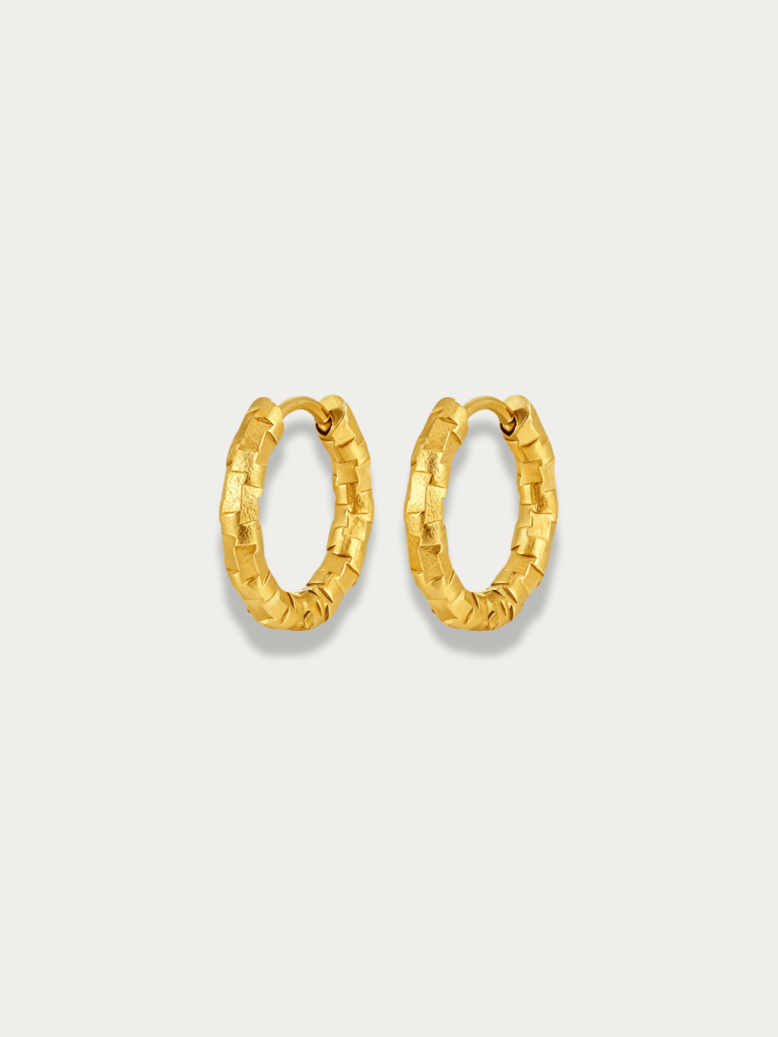 Atlas Textured Hoop Earrings in gold, 15mm size, studio hero shot