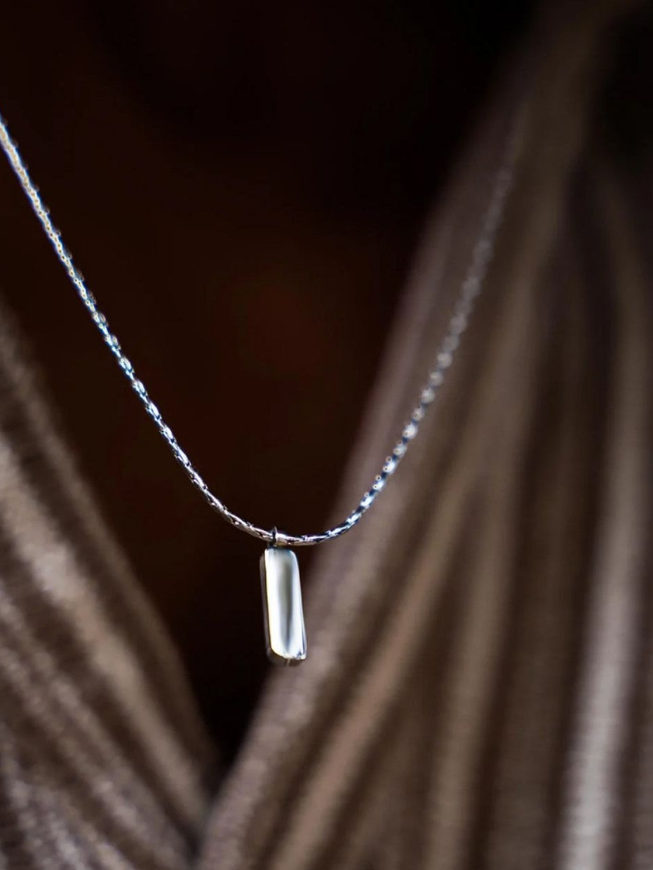 Model wearing Axis Pendant Wheat Chain Necklace