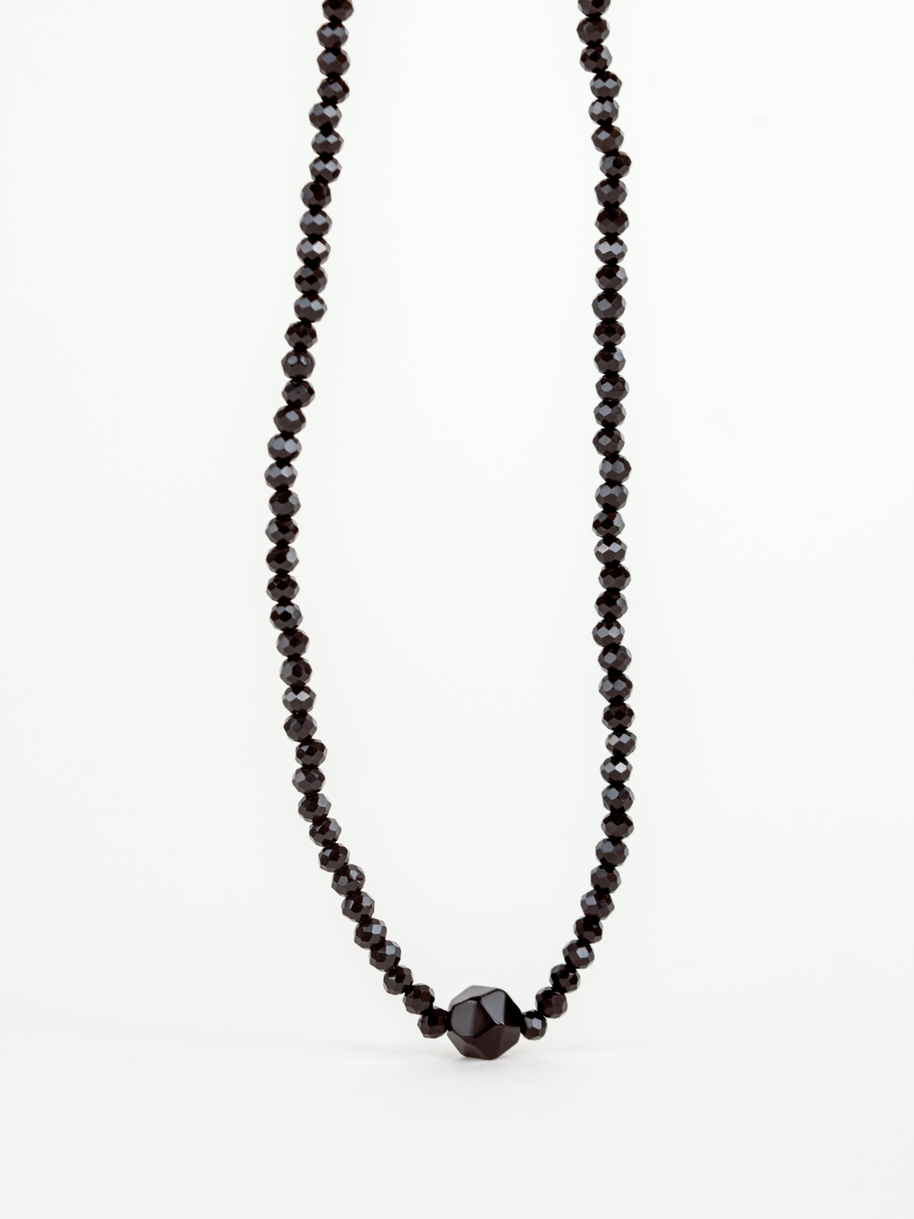 Close-up of faceted black crystal beads on Balance Necklace