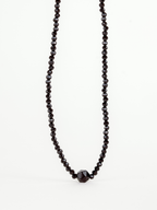 Close-up of faceted black crystal beads on Balance Necklace