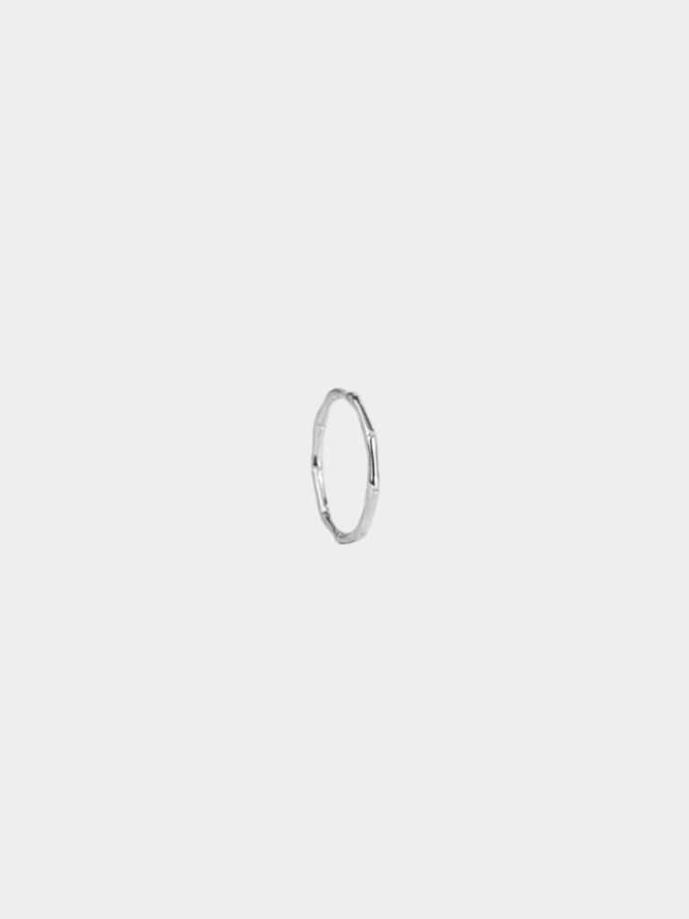 Bamboo Ring in silver tone stainless steel with bamboo-inspired texture, studio hero shot