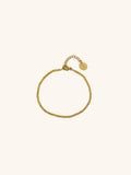 Beaded Bracelet gold tone titanium, continuous ball bead bracelet with MNML disc charm, product flatlay