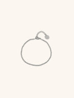 Beaded Bracelet silver tone titanium, continuous ball bead bracelet with MNML disc charm, product flatlay