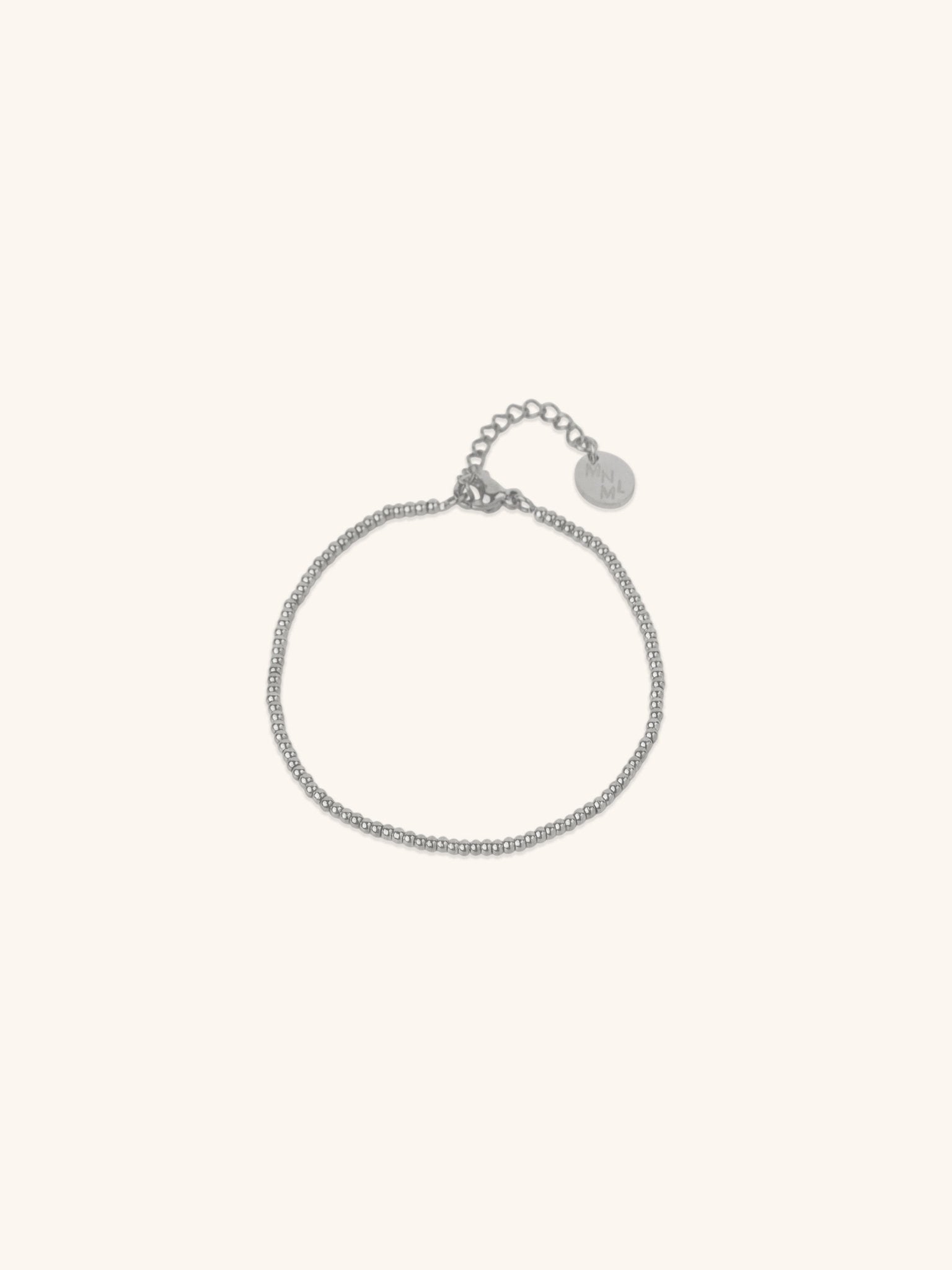 Beaded Bracelet silver tone titanium, continuous ball bead bracelet with MNML disc charm, product flatlay