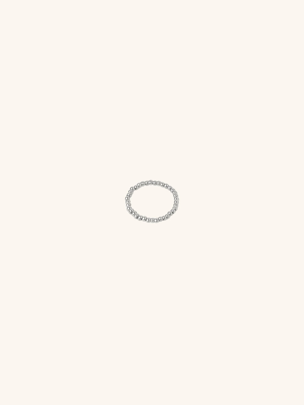 Beaded Elastic Ring silver tone stainless steel, continuous ball beads on elastic band, product flatlay