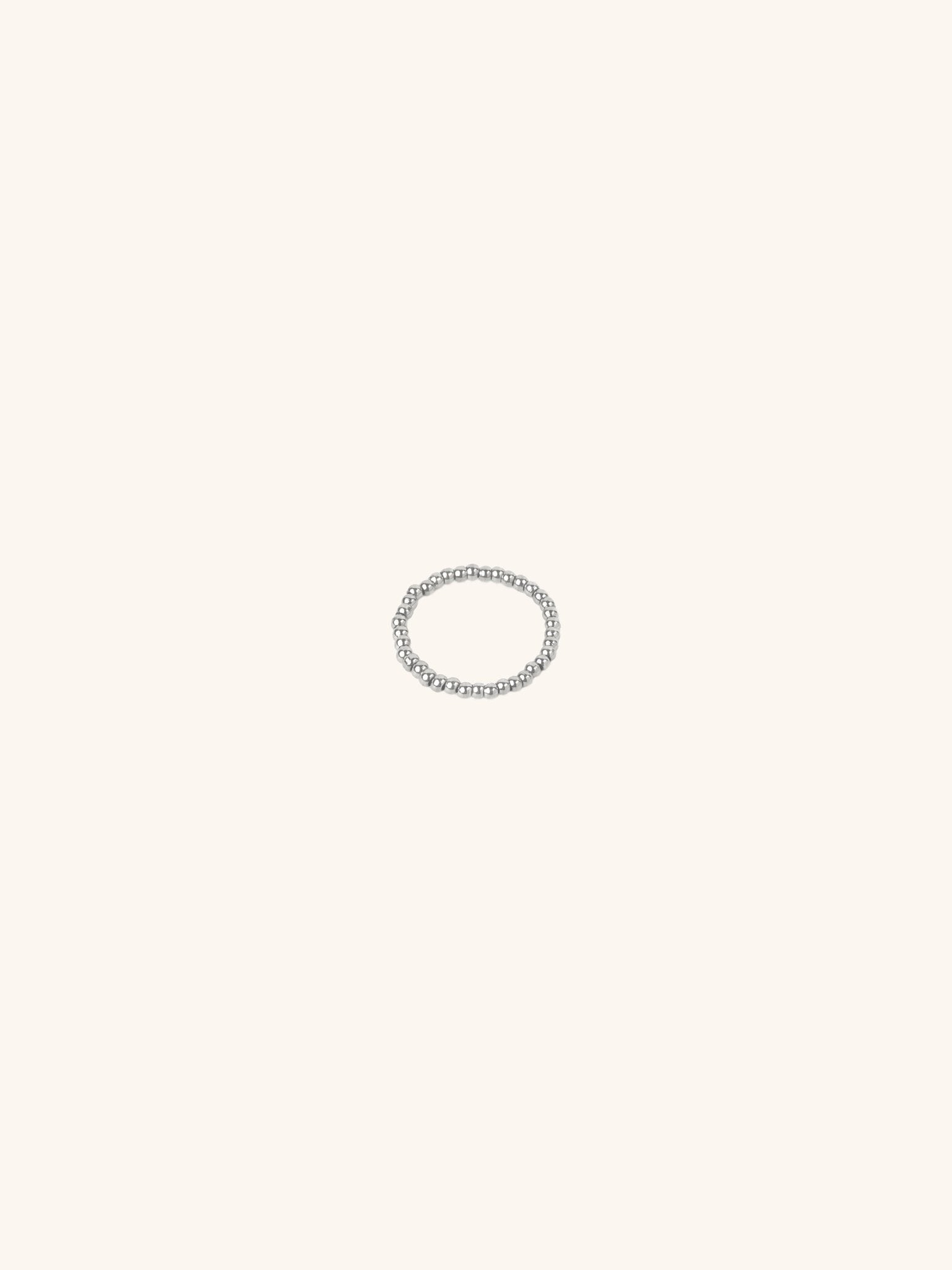 Beaded Elastic Ring silver tone stainless steel, continuous ball beads on elastic band, product flatlay