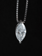 Close-up of marquise-cut moissanite stone on Beatrice necklace showing brilliance and fire