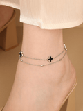 Black Clover Layered Chain Anklet silver tone worn on ankle, double chain with black clover pendants
