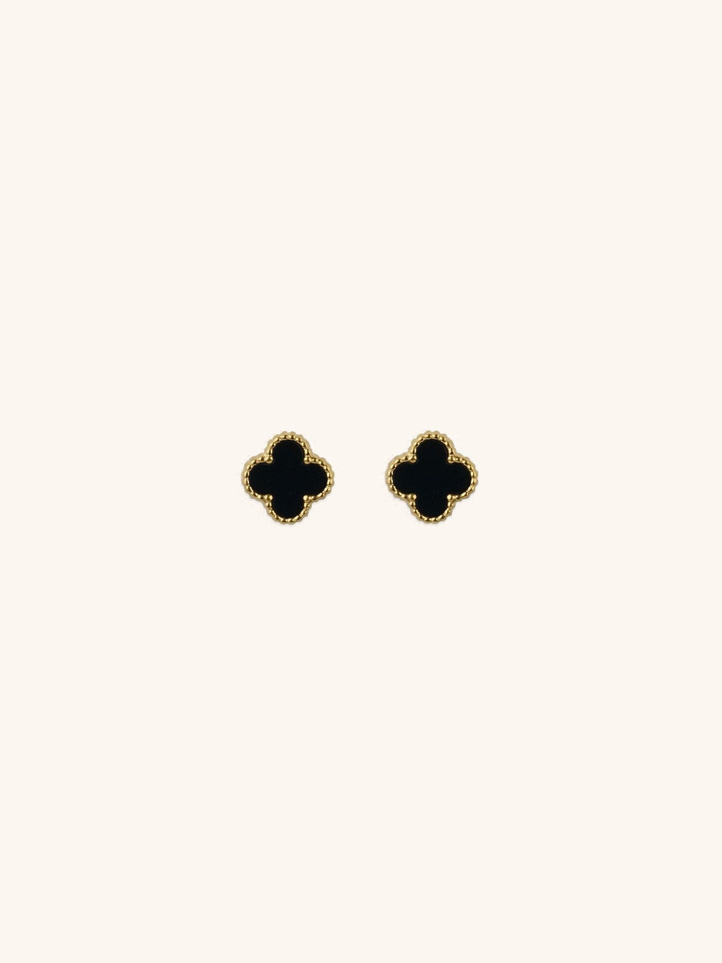 Black Clover Stud Earrings gold tone titanium, four-petal clover with black enamel and milgrain border, product flatlay