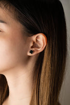 Black Clover Stud Earrings silver tone worn on ear, minimalist clover studs MNML Malaysia lifestyle