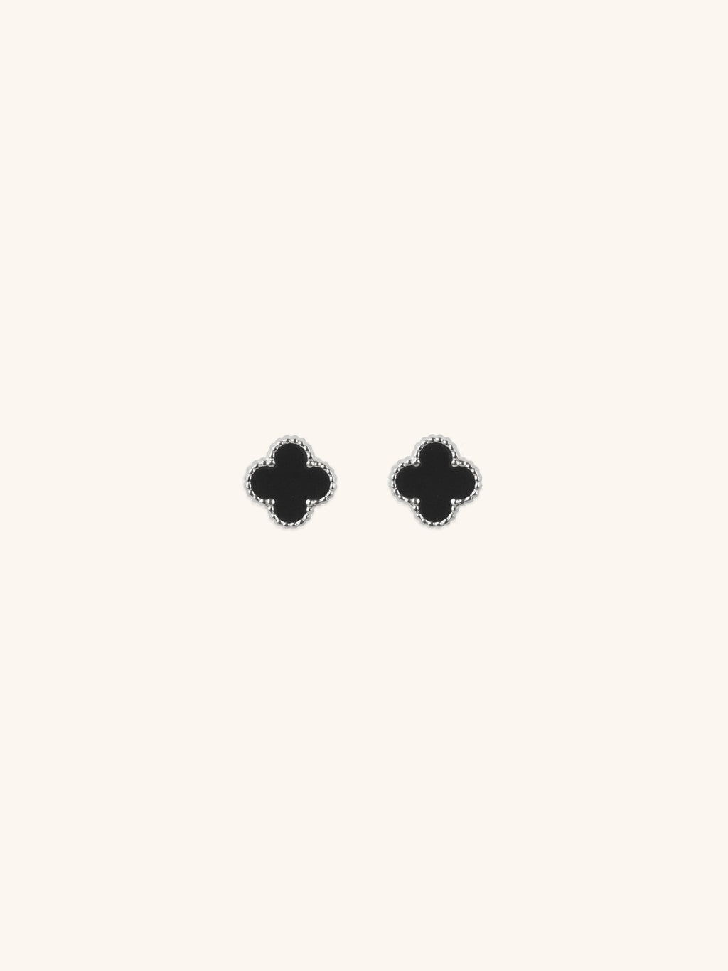 Black Clover Stud Earrings silver tone titanium, four-petal clover with black enamel and milgrain border, product flatlay