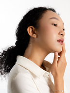 Caulie moissanite stud earrings worn on model's ear