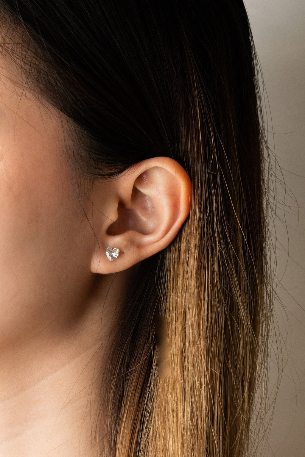 Model wearing CECILIA Diamond Heart stud earring