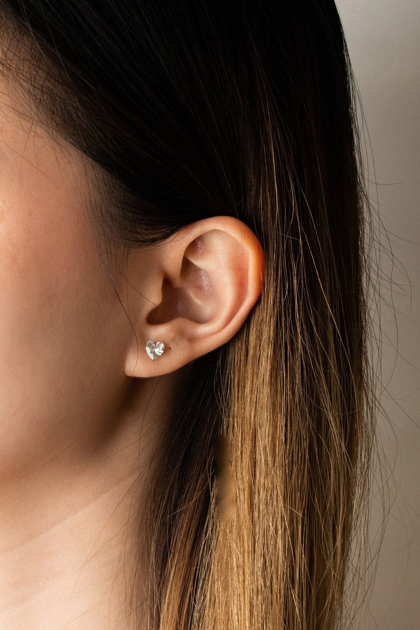 Model wearing CECILIA Diamond Heart stud earring