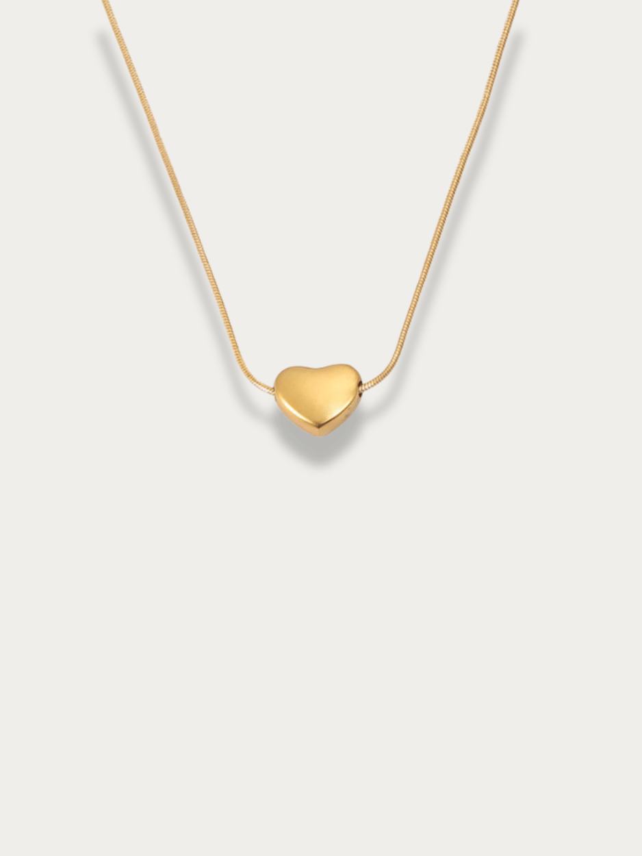 Celeste Dream Heart Engravable Necklace gold tone titanium, puffy heart pendant on snake chain, product flatlay