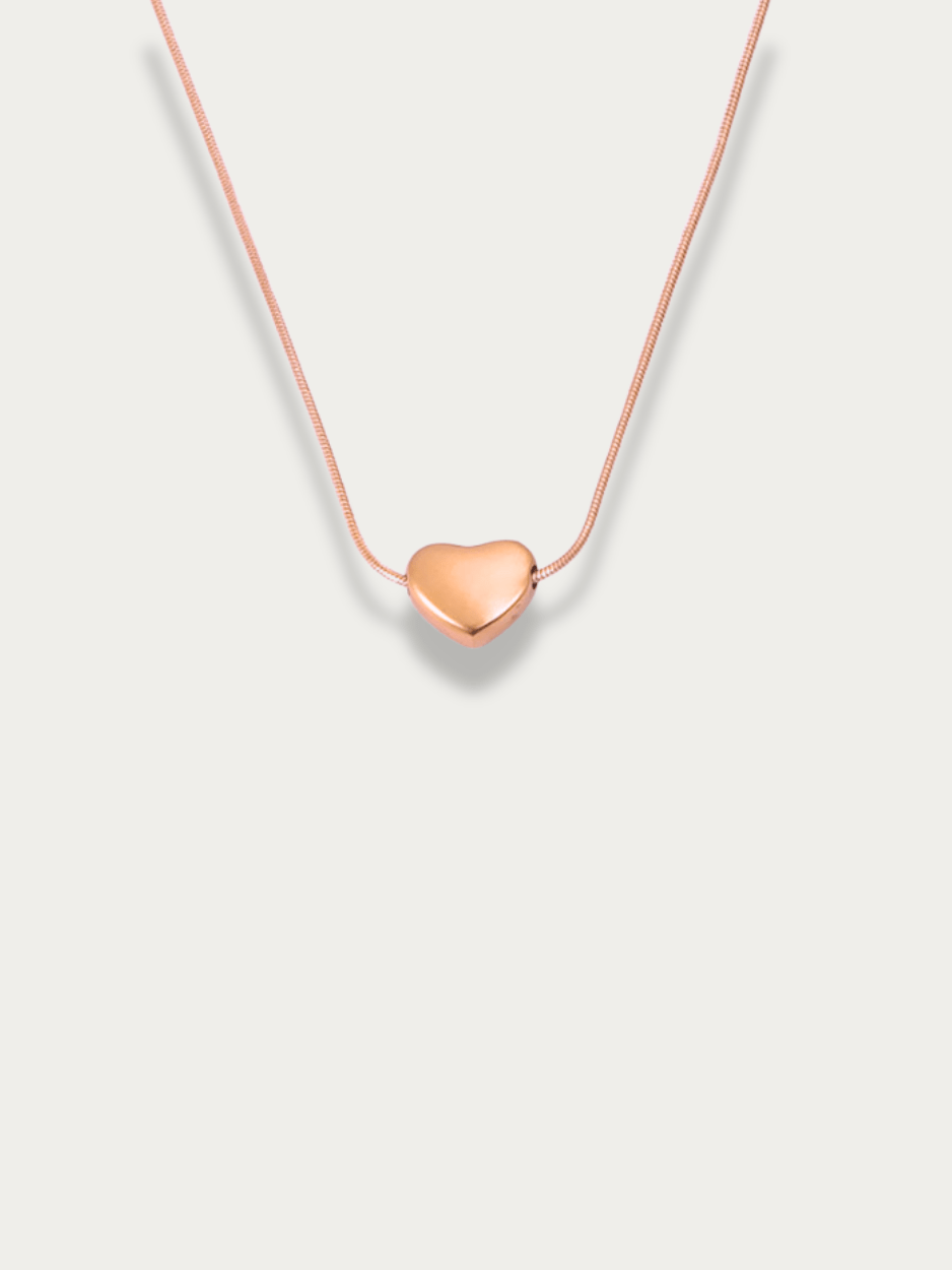 Celeste Dream Heart Engravable Necklace rose gold tone titanium, puffy heart pendant on snake chain, product flatlay