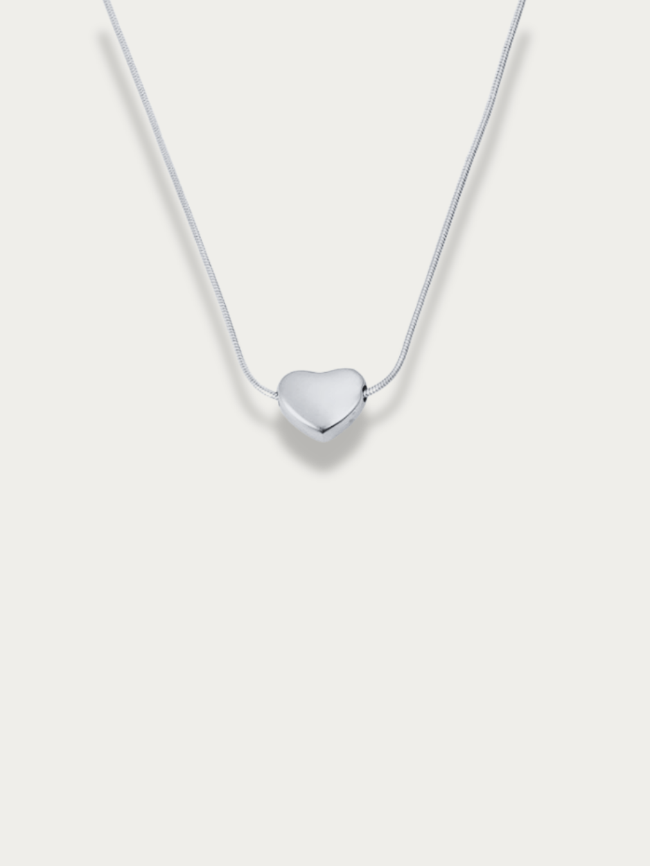 Celeste Dream Heart Engravable Necklace silver tone titanium, puffy heart pendant on snake chain, product flatlay