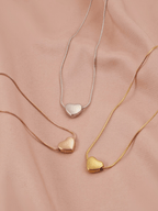 Celeste Dream Heart Necklace in gold, silver and rose gold tone side by side comparison flatlay